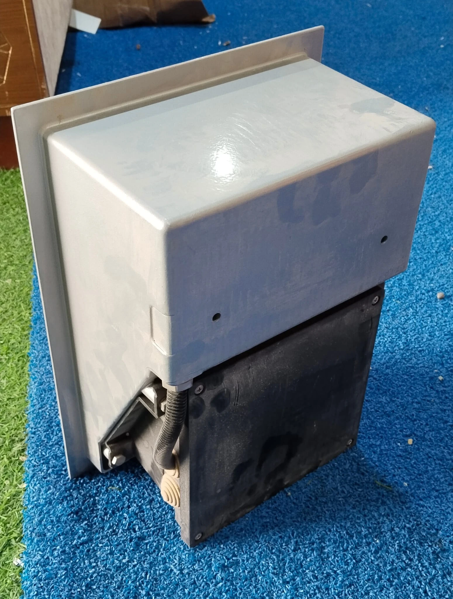 Outdoor Wall-recessed light fixture made of metal with a textured, louvered face - View 1